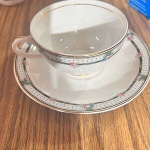Classic White Porcelain Teacup and Saucer with Pink Floral Motif and Gold Trim